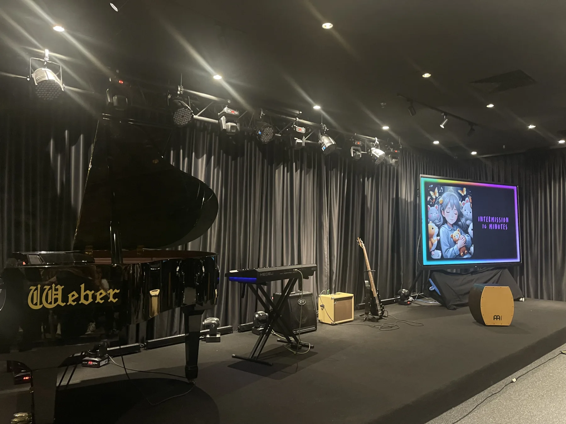 Concert stage with grand piano and instruments at Magic Dojo Event Hall